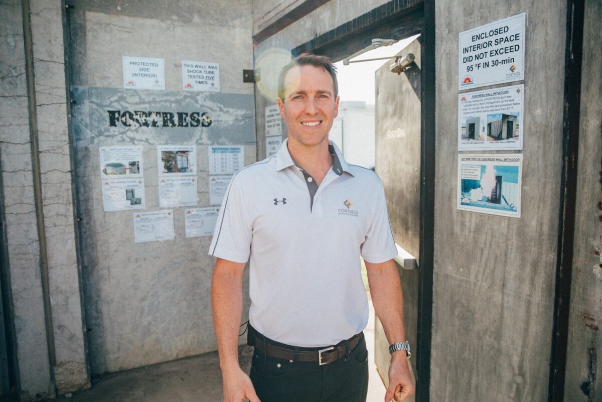 Structural design consultant and blast resistant design engineer Thomas Mander standing inside tested FORTRESS building components.