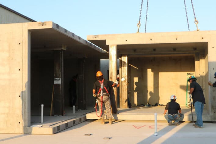 Workers installing a blast resistant structure, the FORTRESS.